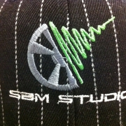 Embroidery detail on striped hat