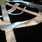 Silver foils on black t-shirt